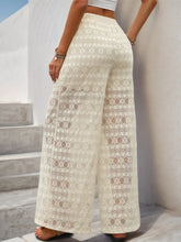 Cream-colored decorative button wide leg pants featuring an intricate lace pattern and a comfortable wide leg fit