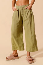 Olive green wide leg SO ME mid rise chino pants with pleated design buttoned cuffs and care instructions
