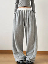 Gray heathered drawstring wide leg pants with white drawstring and side seam stitching for casual wear