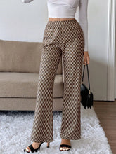 Brown and beige plaid high-waisted wide leg pants made of soft woven material with easy care instructions
