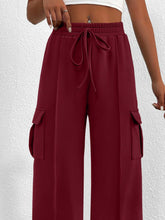 Maroon casual high waist cargo pants with elastic waistband, drawstring, and large side pockets for comfortable wear