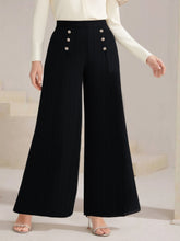 Plus size high waist wide leg black trousers with silver button detailing on the front for a stylish look