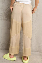 Beige pol elastic waistband wide leg pants with contrasting textured panels and ribbed cuffs for a relaxed fit