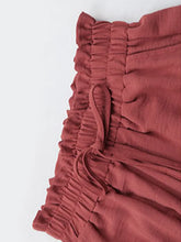 Rust-colored ruched fabric shorts with a drawstring waistband from the perfee frill tied wide leg collection