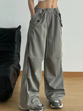 Gray wide leg drawstring pants with cargo pockets and adjustable waist for comfortable casual wear