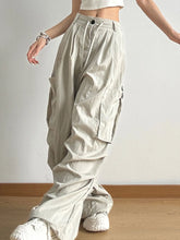 Light gray drawstring wide leg cargo pants featuring multiple pockets and a comfortable waistband design