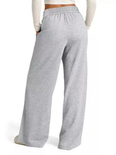 Gray heathered drawstring wide leg pants with elastic waistband and side pockets and easy care instructions
