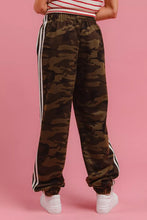 Bi bi side lines camouflage track pants featuring camouflage pattern with white side stripes and elastic cuffs