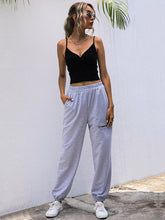Light gray soft cotton casual high waist cutout joggers with elastic waistband and side pockets with care instructions