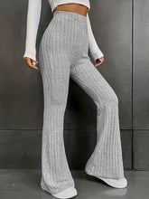 Plus size gray ribbed knit high waist flare pants with a ribbed texture and flared leg design