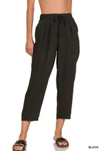 Black woven crepe loose-fitting cropped pants with elastic band waist and drawstring from zenana