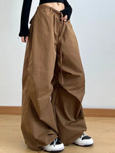 Brown wide leg casual drawstring pants with a perfect fit, loose cargo style, side pockets, and drawstring waist
