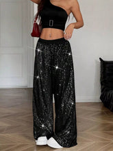 Black sequin wide leg pants featuring a shimmering starry texture for elegant evening wear