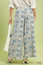 Beige umgee linen printed wide leg pants with blue botanical print and raw hem frayed detailing