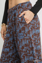Umgee scenic print casual sweatpants in brown and blue with elastic waistband and embroidered text for relaxed wear