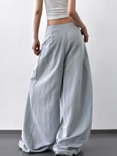 Light gray high-waisted wide leg pants with lace detail and a relaxed flowing silhouette for stylish comfort