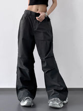 Black wide leg cargo pants with relaxed fit and multiple pockets ideal for casual and utility wear