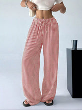 Full size plus size wide-leg pants in red and white vertical stripes with a drawstring waist for adjustable comfort