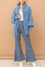Blue denim jacket with ruffled sleeves and front pockets paired with checkerboard high waist bell pants