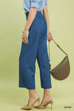 Blue umgee denim wide leg crop pants with a high-waisted elasticated waist and two front pockets in denim material