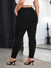 Black plus size elegant chain high waist skinny pants with subtle ribbed texture and form-fitting design