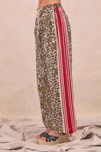 BiBi leopard print pants with wide-leg design and bold red and white vertical side stripes with tucking welt pocket