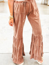 Soft dusty rose velvet drawstring flare ruffle pants with tiered ruffles and elastic waistband for stylish comfort