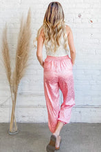 Pink satin leopard print joggers with high-waisted elastic and cuffed hems machine wash cold safe
