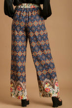 Umgee full size mixed print wide-leg trousers with elastic waistband in vibrant geometric and floral pattern on deep blue base