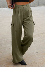 Olive green ruched wide leg pants with pleated front and side cargo pockets for stylish casual wear