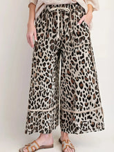 Beige leopard print wide leg pants with drawstring waist and frayed hem for casual wear