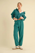 Teal cropped zip-up sweatshirt with ruffled sleeves and matching elastic waist joggers by aemi+co featuring drawstring elastic waist