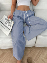 Blue and white drawstring striped wide leg pants featuring a comfortable waist and wide leg design