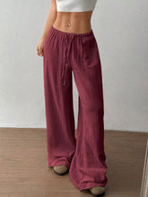 Full size drawstring wide leg pants in maroon with lightweight textured fabric and adjustable waist for plus size comfort