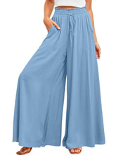 Light blue wide leg pants with elastic waistband drawstring and pockets for comfortable casual wear