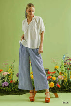 Blue and white striped umgee linen blend wide leg pants made from breathable linen blend fabric for comfortable wear
