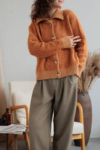 Orange fuzzy long sleeve cardigan with collared neck button front