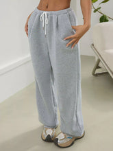 Light gray heathered casual drawstring sweatpants with high waist and relaxed wide-leg cut