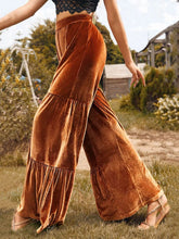 Copper-colored velvet high waist wide leg pants featuring tiered ruffles for an elegant and stylish look