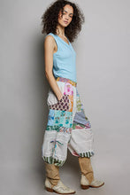 Pol printed patchwork wide leg pants with vibrant floral, striped, and solid panels and white canvas pockets