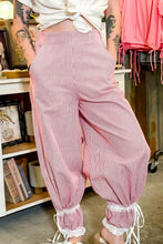 Pink and white stripe contrast lace high-waisted harem pants with ribbon tie and lace trim at the cuffs