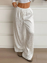 White leopard print wide leg pants with elastic waistband and drawstring for comfortable casual wear