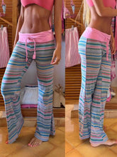 Wide-leg drawstring striped pants in pink and blue with a matching pink waistband perfect for casual wear