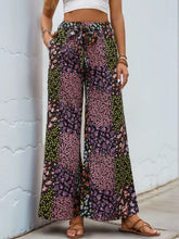 Floral high rise wide leg pants with patchwork pink green and black small blossoms pattern design