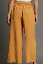Umgee full size mustard-yellow wide-leg pants with rope drawstring elastic waistband and flowing fabric care instructions included