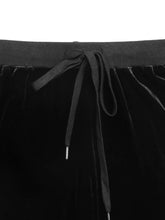 Black velvet wide-leg drawstring pants with ribbed elastic waistband suitable for comfortable casual wear and care instructions