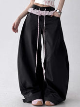 Black wide leg drawstring casual pants with ruffled striped waistband and matching drawstrings for comfortable wear