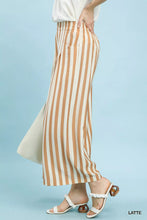 Umgee vertical stripe wide leg pants in beige and white lightweight fabric with relaxed fit wide leg pants design