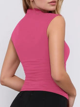 Magenta ribbed sleeveless crop top with high neckline, machine wash cold