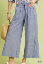 Umgee linen blend striped wide leg pants in blue and white with a drawstring waistband made from linen blend fabric